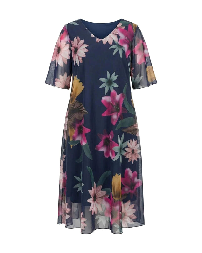 Официална тъмносиня макси рокля с ефирен флорален шифон и V-образно деколте, представена отпред на бял фон.