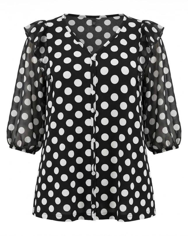 Тъмносиня дамска туника на бели точки с ефирни прозрачни ръкави и V-образно деколте, изглед отпред на бял фон.