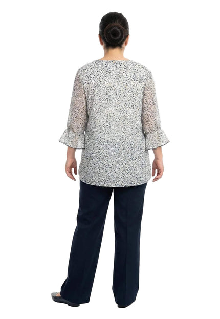 Официална бяла макси туника с нежен флорален принт и ръкави с волани, заснета в цял ръст отзад.