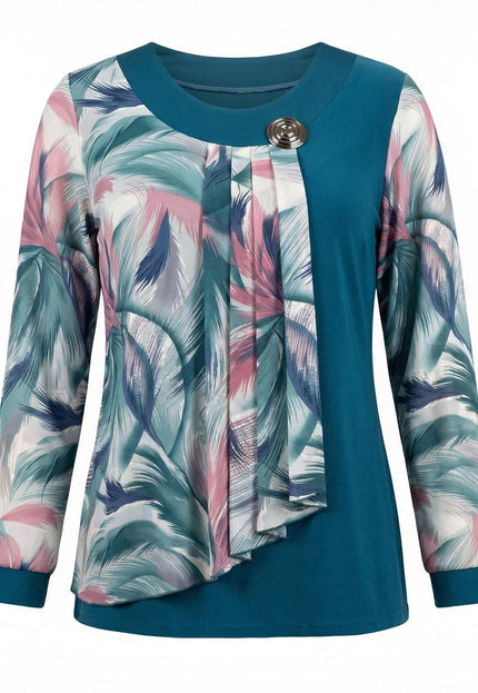 Официална макси туника в цвят петрол с ефирен шифон на абстрактни шарки и метална брошка, заснета в цял ръст отпред.